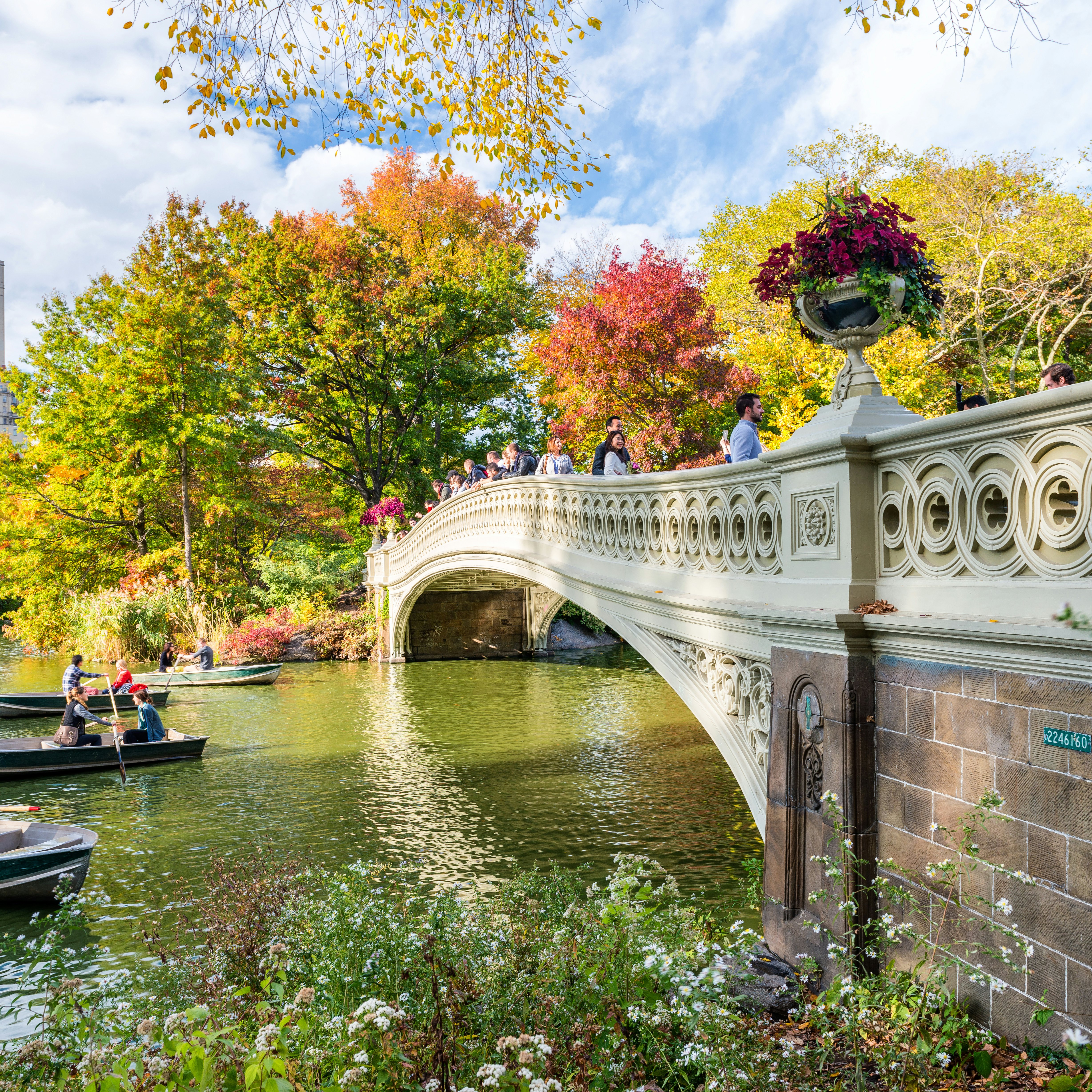OCTOBER 2015: Visitors paddle in boats near a bridge at Central Park..